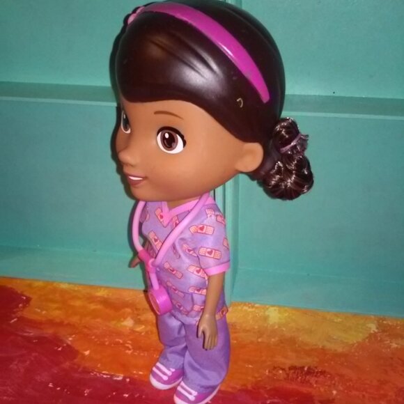 Doc Mcstuffins Doll in purple & pink  scrubs with a mini doc - Picture 6 of 8